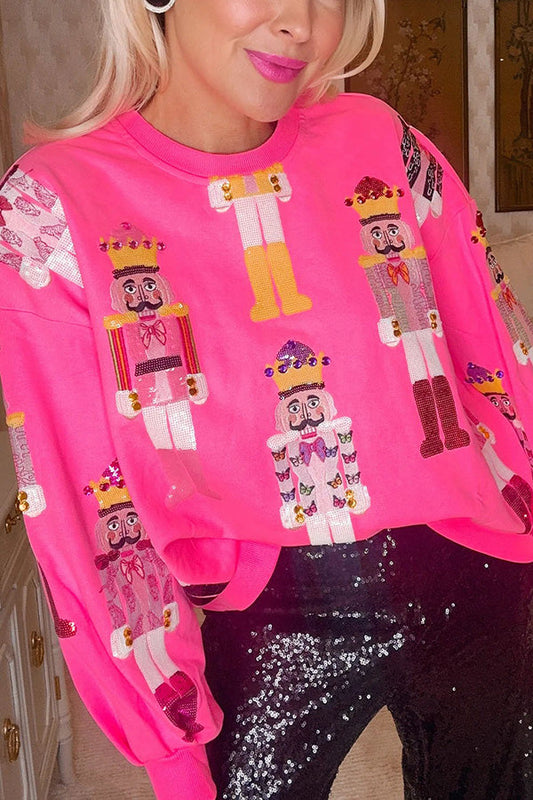 Julesweater dame med nøddeknækkere og pailletter, løs pasform