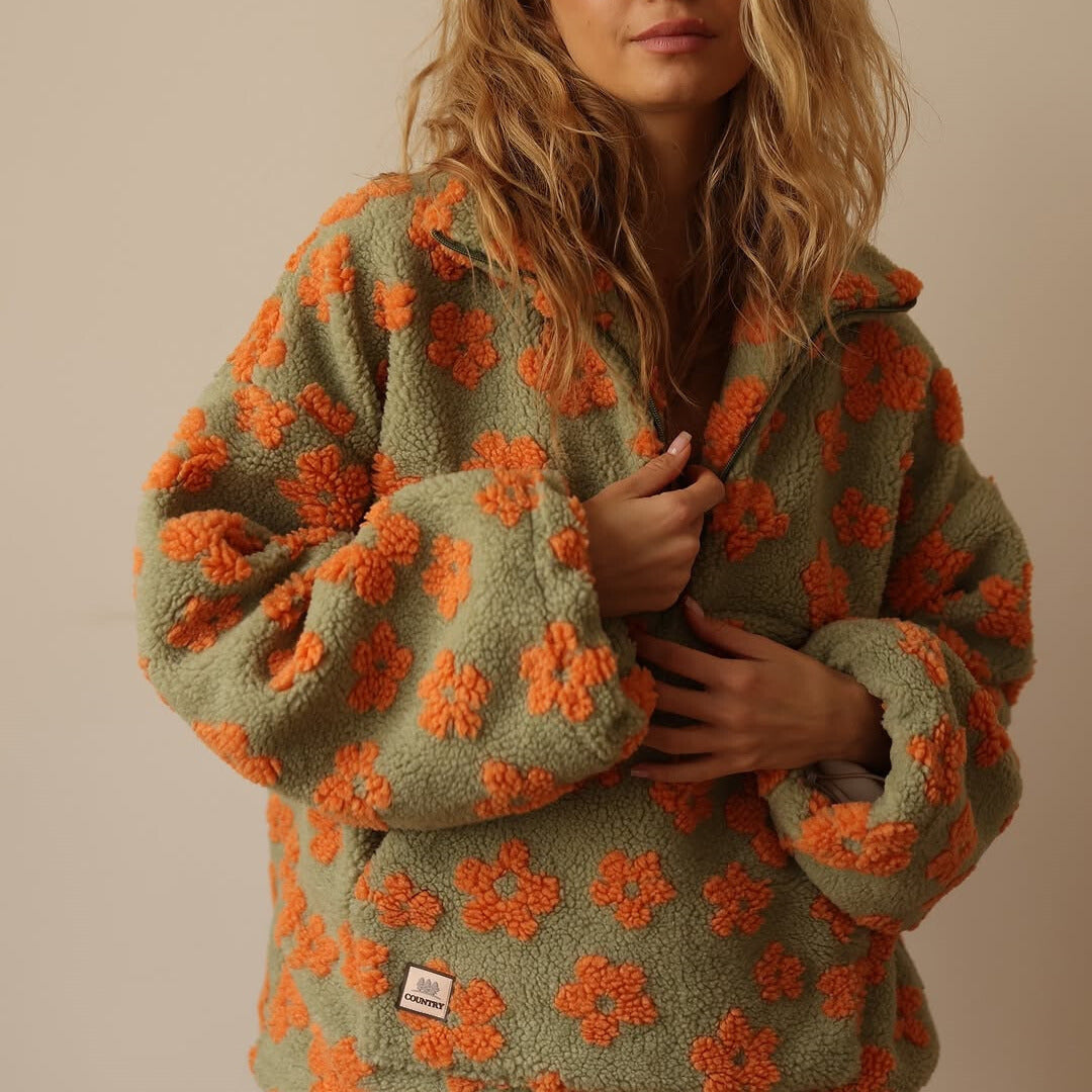 Hoodie til damer med halv lynlås og blomsterprint i oversized fit