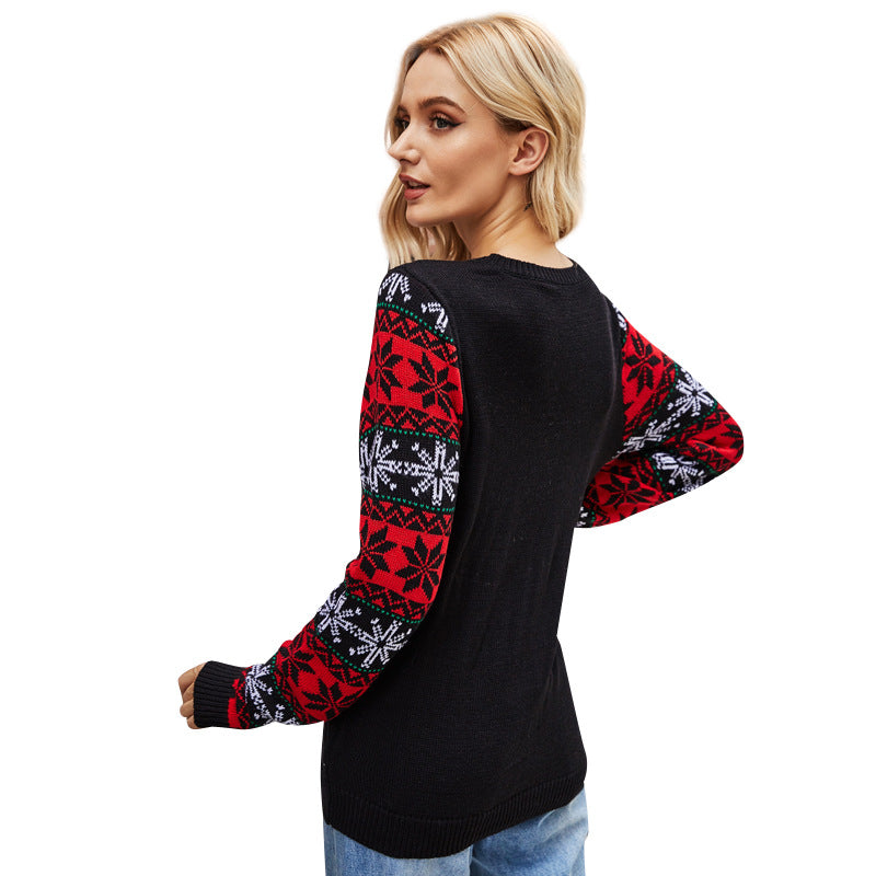 Julesweater dame med julemand i palietter og snefnugmønster på ærmerne