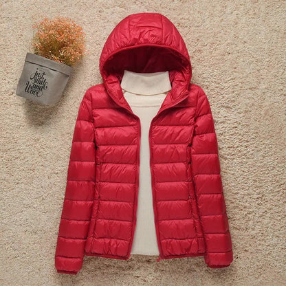 Puffer jakke med hætte og lynlås til damer i kort model
